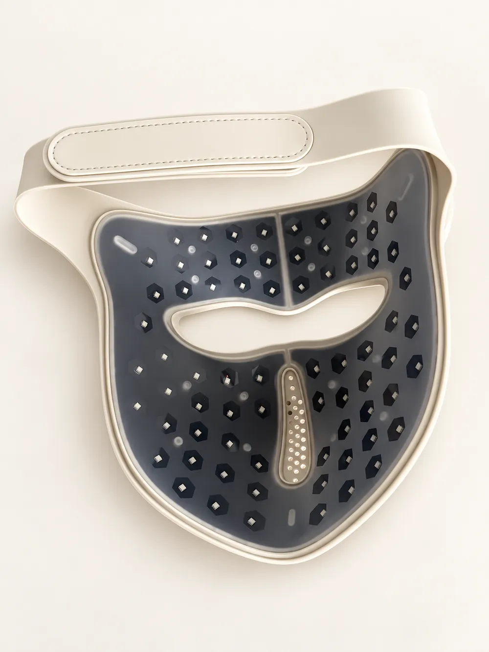 Inside view of the Luxe Mask showing the light array, eye opening and strap on an ivory studio background